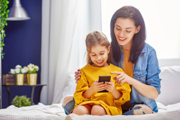 Mom and daughter are playing