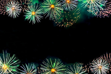 Fireworks display as flowers on dark sky background with copy space