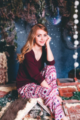 Fototapeta premium Girl on a rooftop in new year/Christmas