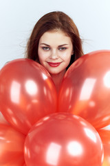 1723579 lovely woman with balloons on a light background portrait, holiday