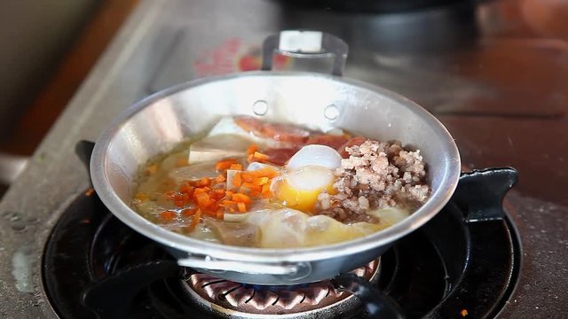 Chef Making Pan-Fried Egg with Chinese Sausage and Pork Topping