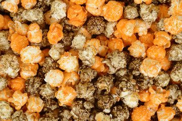 closeup of halloween black licorice and orange popcorn