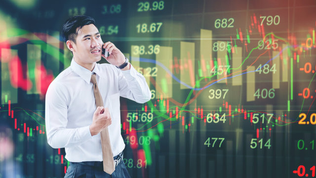 Professional businessman using smartphone  talking on his phone smiling happy on digital stock market financial exchange information and Trading graph background
