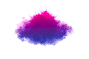 Splash of colorful powder over white background.