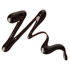 Chocolate syrup drop isolated on white background. Top view. .