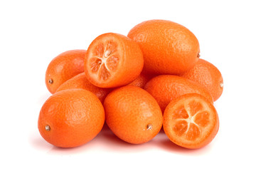 Cumquat or kumquat with half isolated on white background close up