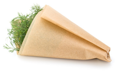 fresh green dill herb leaves bunch in cone of paper isolated on white background cutout