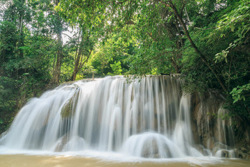 Fototapeta na wymiar Erawan waterfall in the rainy season with turbid water