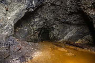 Underground abandoned mica ore mine shaft tunnel gallery passage