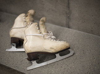 Professional ice skating shoes in dressing room after training - obrazy, fototapety, plakaty