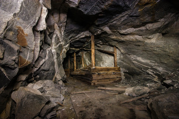 Fototapeta na wymiar Old abandoned underground ore mica mine shaft tunnel