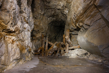 Old abandoned underground ore mica  mine shaft tunnel