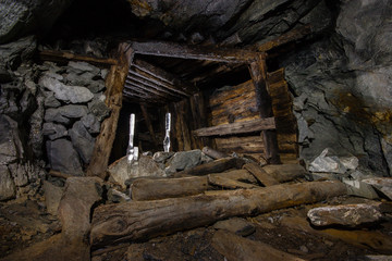 Fototapeta na wymiar Old abandoned underground ore mica mine shaft tunnel