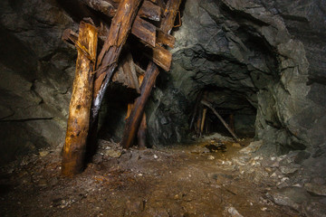 Old abandoned underground ore mica  mine shaft tunnel