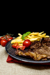 juicy steak beef meat with tomato and french fries