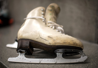 Professional ice skating shoes in dressing room after training