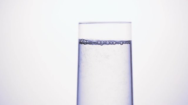 Pouring water into glass