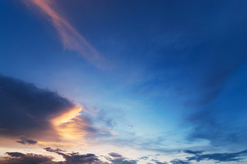 Fototapeta na wymiar Sky blue and orange light of the sun through the clouds in the sky
