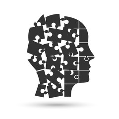 Head profile silhouette made of jigsaw puzzle pieces falling apart