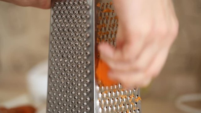 Carrot grating on metal grater 