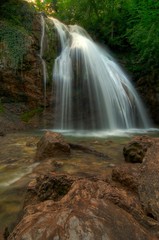 Fototapeta na wymiar Jur-Jur the most full-flowing waterfall of Crimea.
