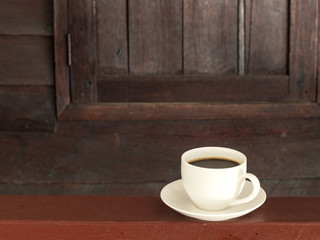 Cup coffee on wooden table old wood background