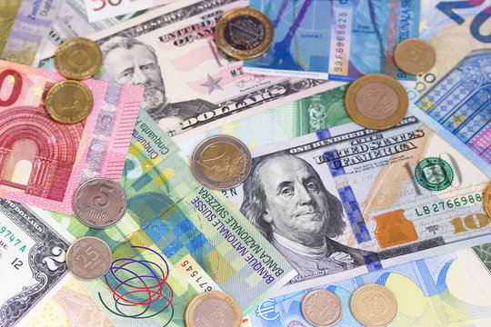 Abstract dollar euro swiss franc and coins background.