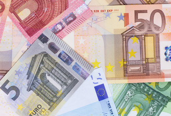 euro money of different denominations abstract background.