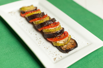 Ratatouille on white plate on wood table