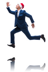 Young busnessman wearing santa hat in christmas concept on white