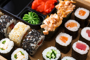 Closeup set of sushi rolls,maki and gukan on wooden background