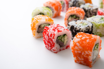 Closeup set of sushi rolls,maki on white background copy space