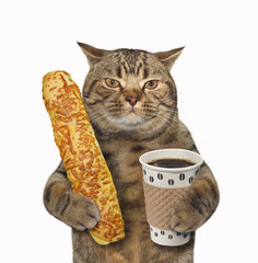 The cat  is holding a cup of black coffee and a baguette. White background.
