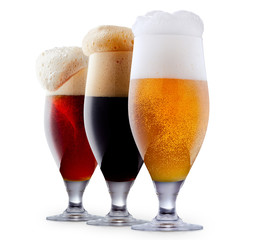 Mug collection of frosty dark red and light beer with foam isolated on a white background