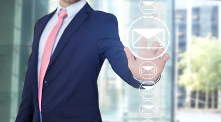 Businessman touching technology interface with professional email  icon
