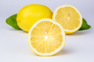 Fototapeta na wymiar Cut lemons on a white background.