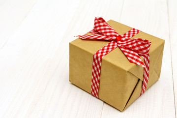 vintage gift box package on white wooden background