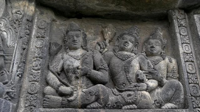 Bas-relief inside Prambanan temple complex. Yogyakarta, Central Java, Indonesia. Crane shot