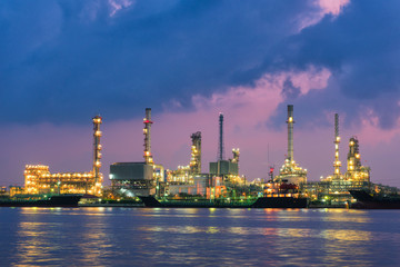 Fototapeta premium Oil refinery plant and shipping loading dock at twilight scene, Oil and Gas industry