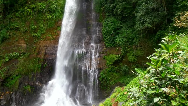 Crane shot of big tropical waterfall
