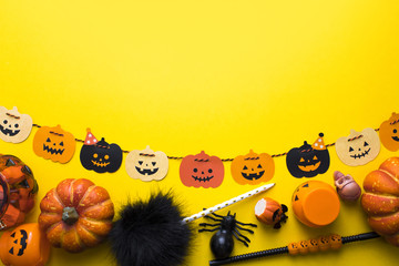 top view halloween prop decor colorful and paper hanging on yellow ground