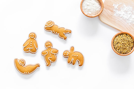 Make gluten free healthy food. Yoga asanas cookies near desk, flour and wheat on white background top view