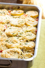 Potatoes and tomatoes baked with cheese