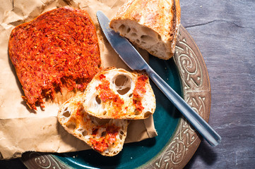 Spicy Italian Nduja Calabrian sausage served with rustic home baked sourdough bread.