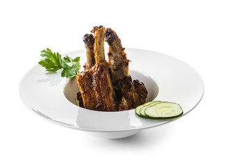 fried ribs with sauce and vegetables