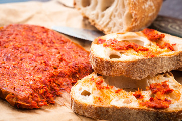 Spicy Italian Nduja Calabrian sausage served with rustic home baked sourdough bread.