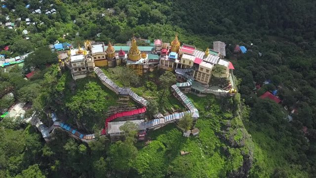 Aerial view from the drone on the Mount Popa,home of Nat the Burmese mythology ghost this place is the old volcano in Bagan, Myanmar