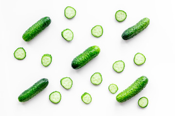 Fresh cucumbers pattern on white background top view