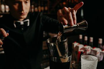 process of preparing a cocktail bartender's from passion fruits