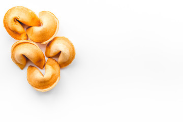 Chinese fortune cookie with prediction on white background top view mock up